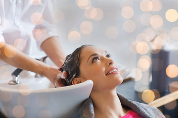 happy young woman at hair salon