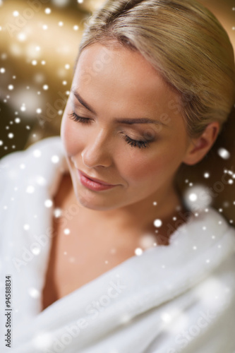 close up of woman sitting in bath robe at spa