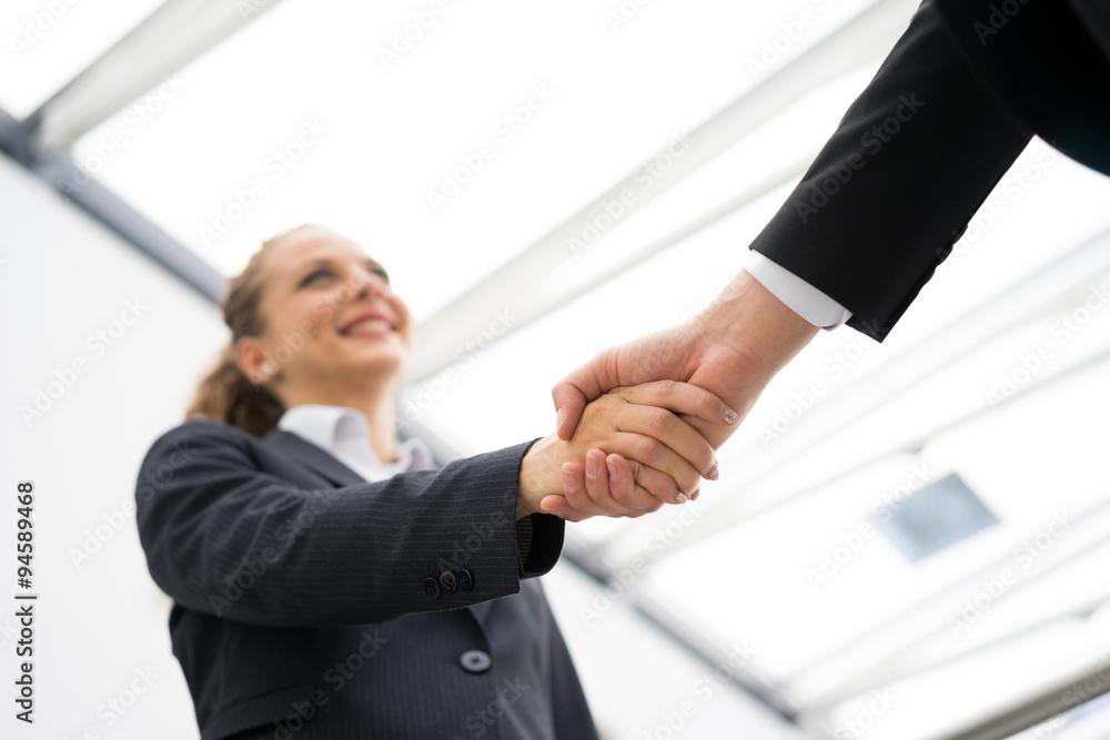 Business man and woman handshake at office Business man and woman handshake at office
