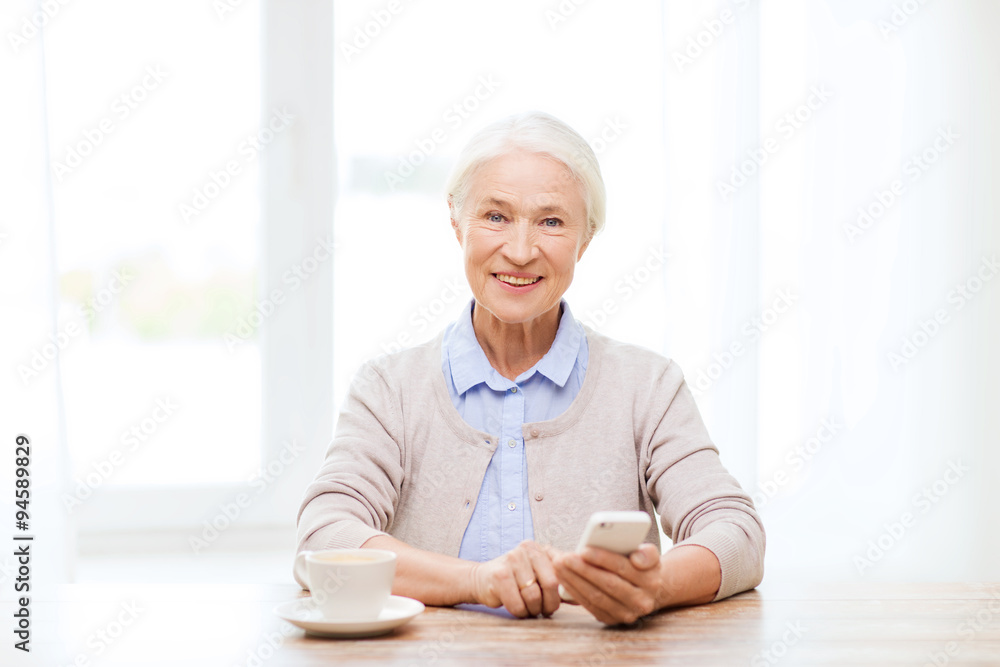 senior woman with smartphone texting at home senior woman with smartphone texting at home