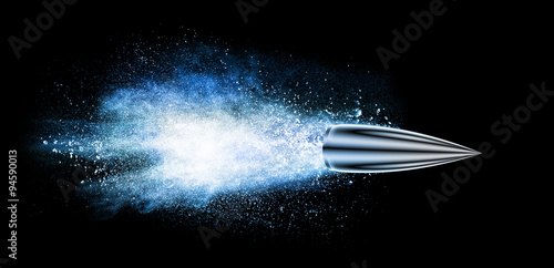 explosion with a bullet isolated on black photo