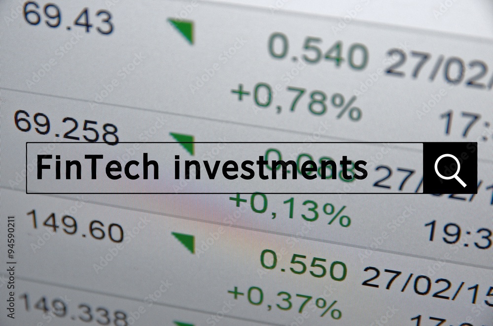 FinTech investments written in search bar with the financial data visible in the background. FinTech investments written in search bar with the financial data visible in the background.