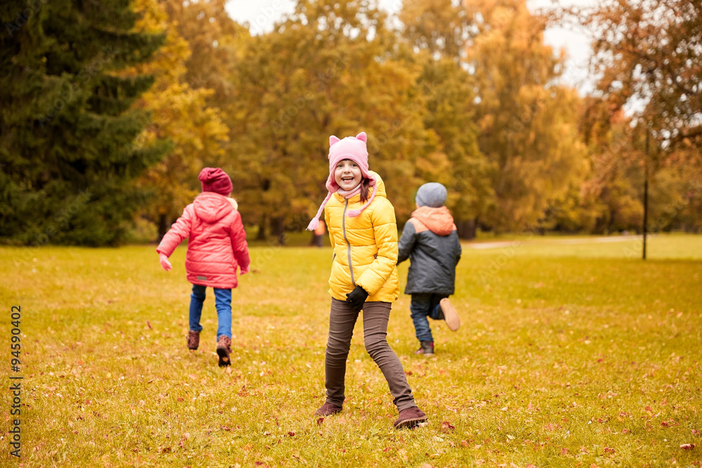 Fototapeta premium group of happy little kids running outdoors
