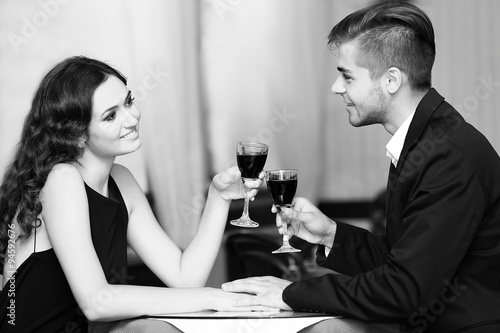 Young couple with wine at r...