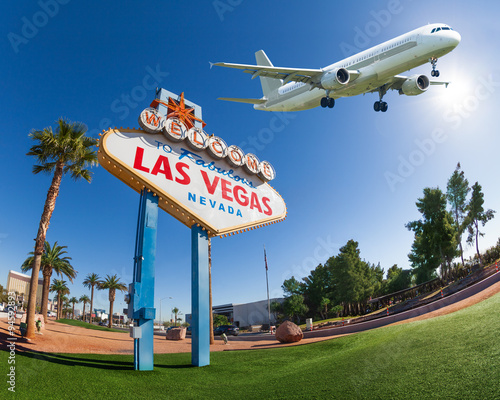 Welcome sign to Las Vegas with airplane in the sky