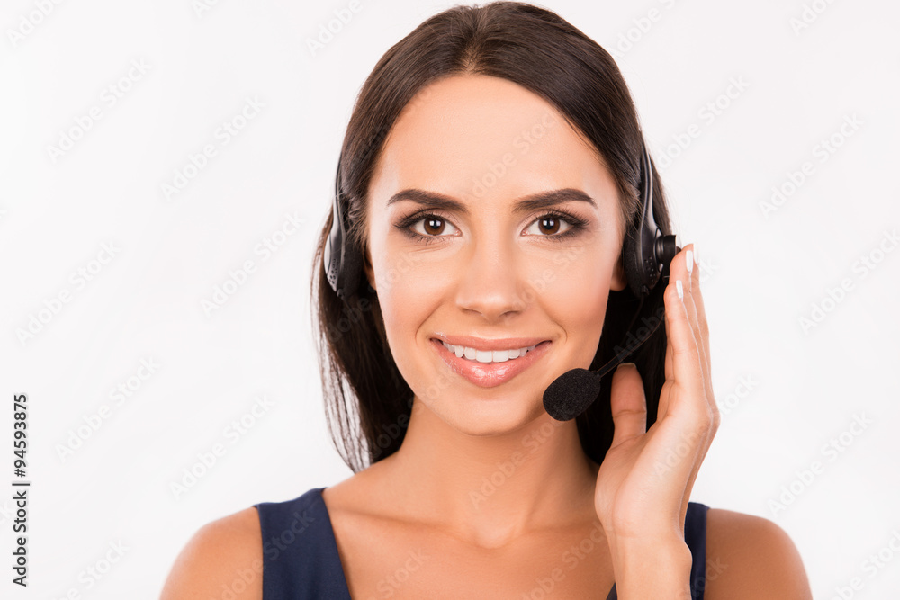 Pretty smiling agent consulting customers on the phone Pretty smiling agent consulting customers on the phone