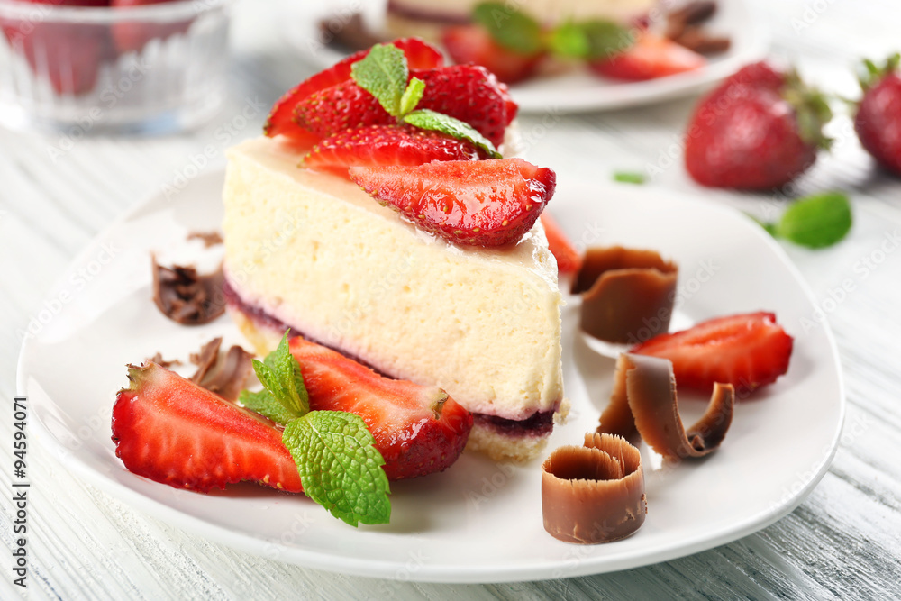 Delicious cheesecake with berries on table close up