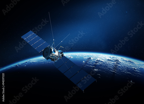 Communications satellite orbiting earth photo