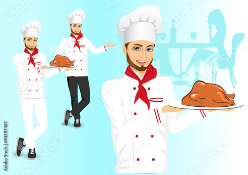 male chef holding a tray with christmas roasted turkey
