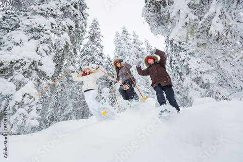 Canvas Print Young adults snowshoeing