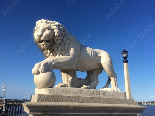 One of a pair of Medici lions guards the Bridge Of Lions, St. Augustine, Florida, USA. 