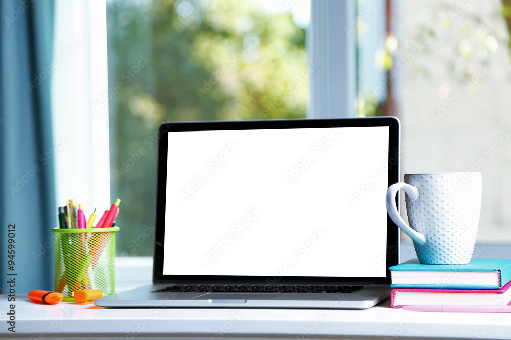 Desktop with notebook on window background Desktop with notebook on window background