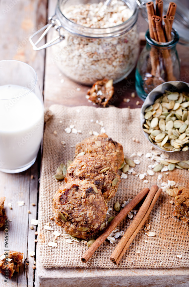 Fototapeta premium Oat and peanut butter cookies with pumpkin seeds,cinnamon,milk.