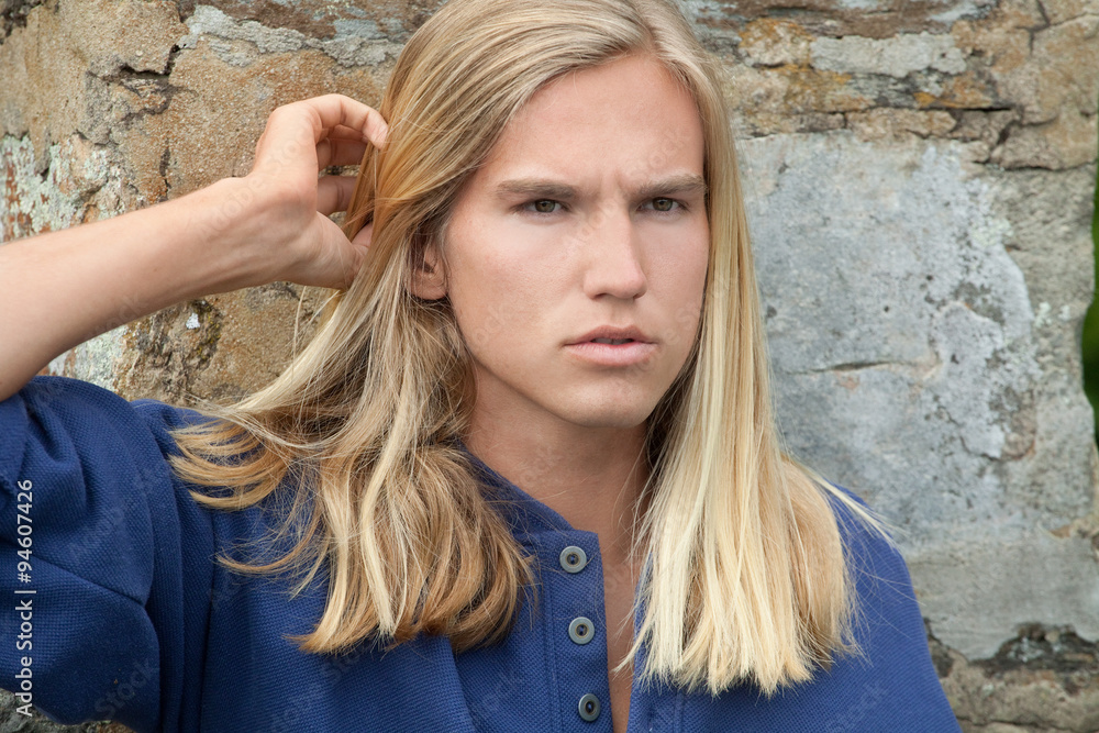 Attractive Young Man With Long Blonde Hair Stock Photo | Adobe Stock