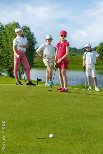 Kids playing golf