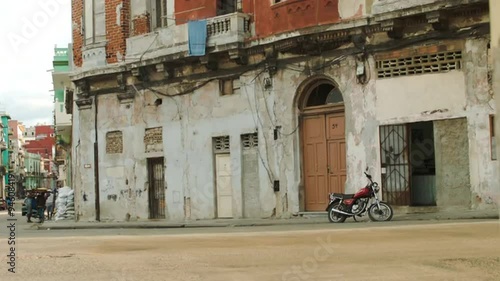 Car passing on an old Havana's alley street