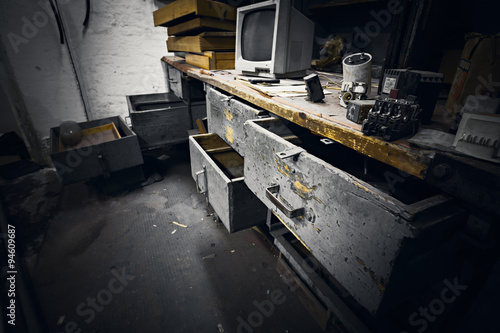 dirty office furniture in an abandoned factory