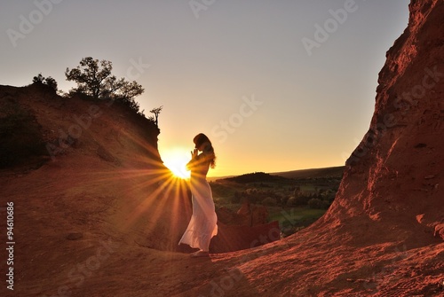 Woman in prayer in the sun, Colorado provencal, rustrel, France