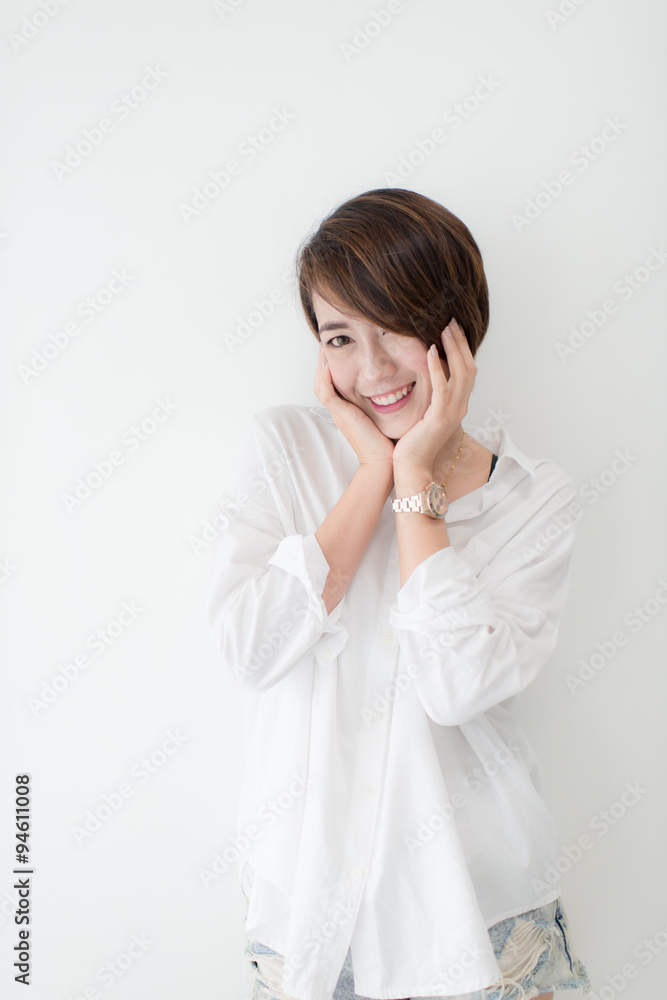 attractive asian woman standing on floor with white wall. attractive asian woman standing on floor with white wall.