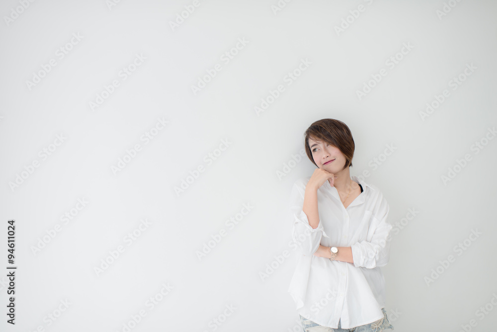 attractive asian woman standing on floor with white wall. attractive asian woman standing on floor with white wall.