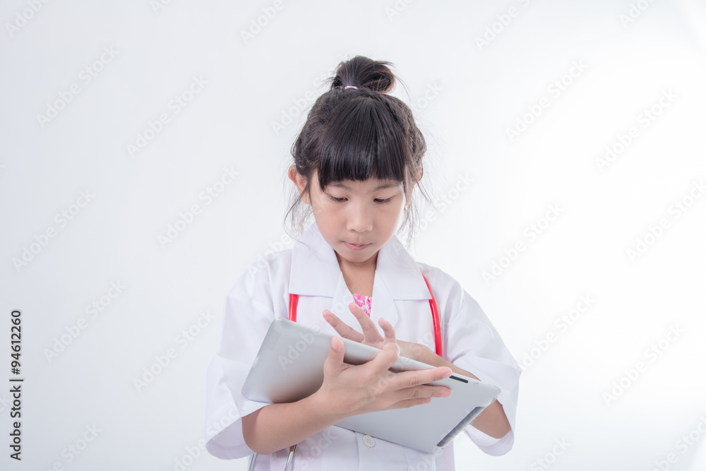 Asian girl doctor with tablet on gray background. Asian girl doctor with tablet on gray background.