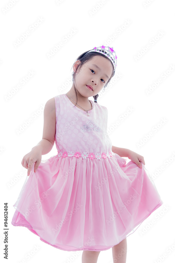 Cute Asian little princess girl in silver crown and pink dress o Cute Asian little princess girl in silver crown and pink dress o