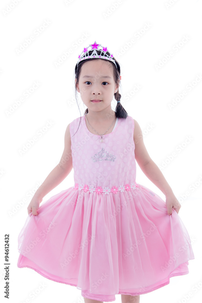 Cute Asian little princess girl in silver crown and pink dress o Cute Asian little princess girl in silver crown and pink dress o
