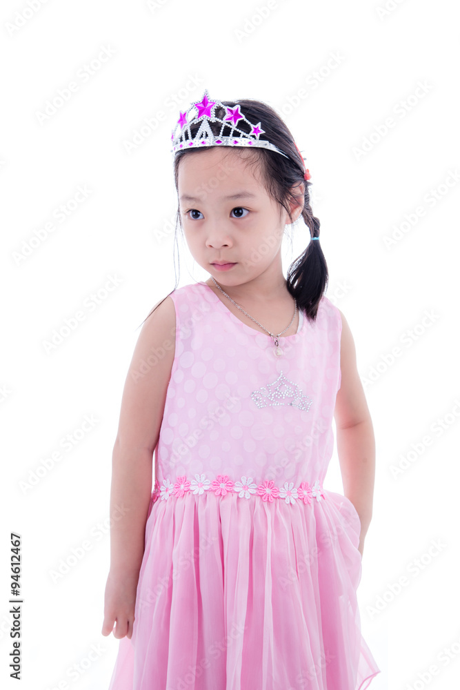 Cute Asian little princess girl in silver crown and pink dress o Cute Asian little princess girl in silver crown and pink dress o