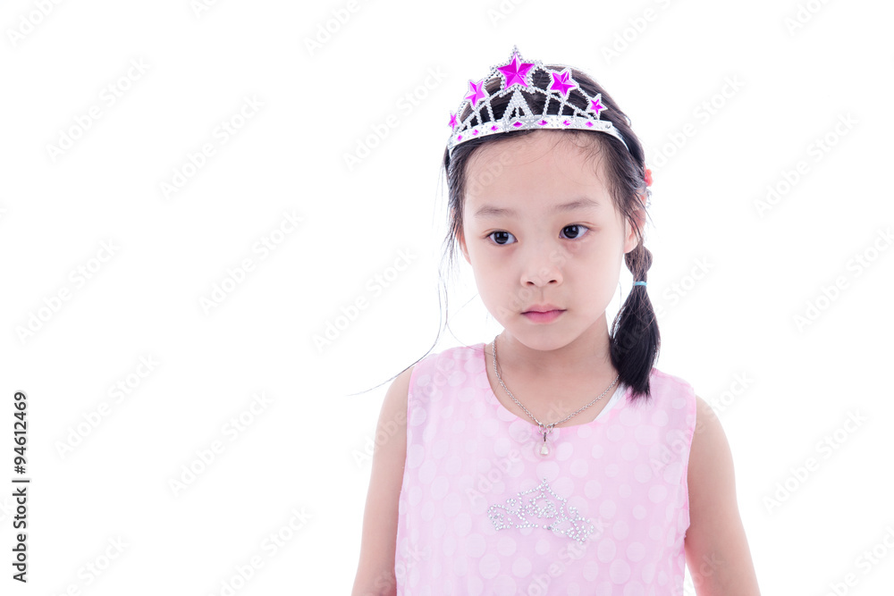 Cute Asian little princess girl in silver crown and pink dress o Cute Asian little princess girl in silver crown and pink dress o