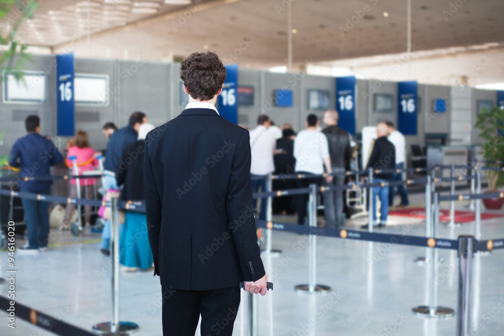 people at the airport, passenger waiting in queue to check in and drop off luggage