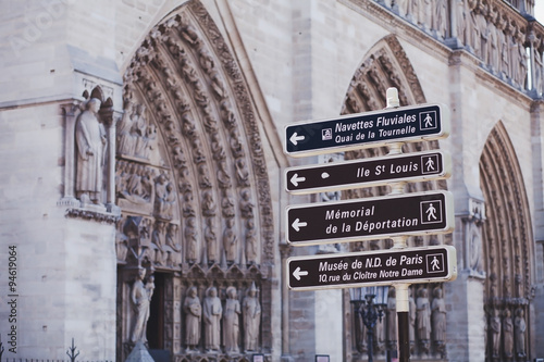 direction sign near Notre Dame, touristic sights of Paris #94619064