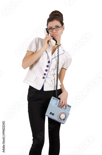 Young woman secretary talking on the phone. Isolated on white photo