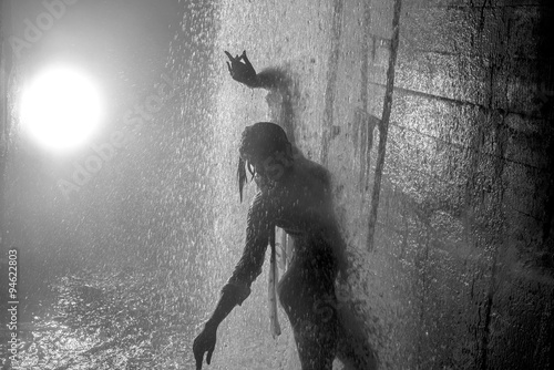 Принти на полотні Young girl dancing streams of water in stormwater