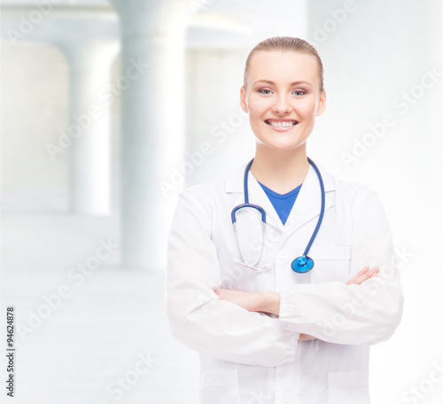 Young  professional and cheerful female doctor being confident o