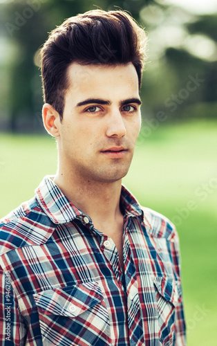  portrait of a young man in plaid shirt