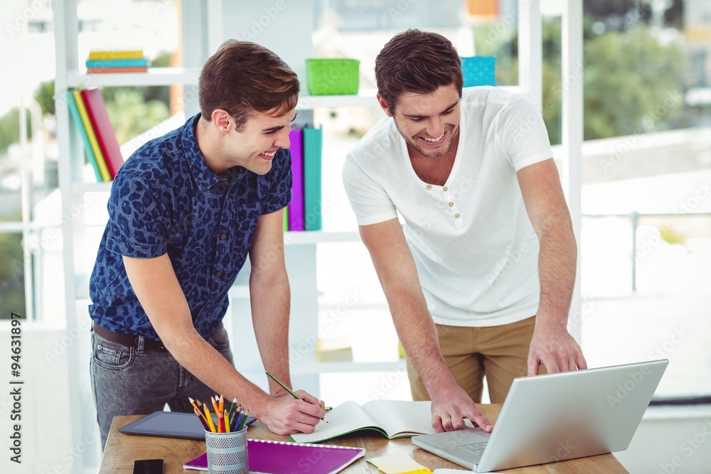 Smiling creative team working together Smiling creative team working together