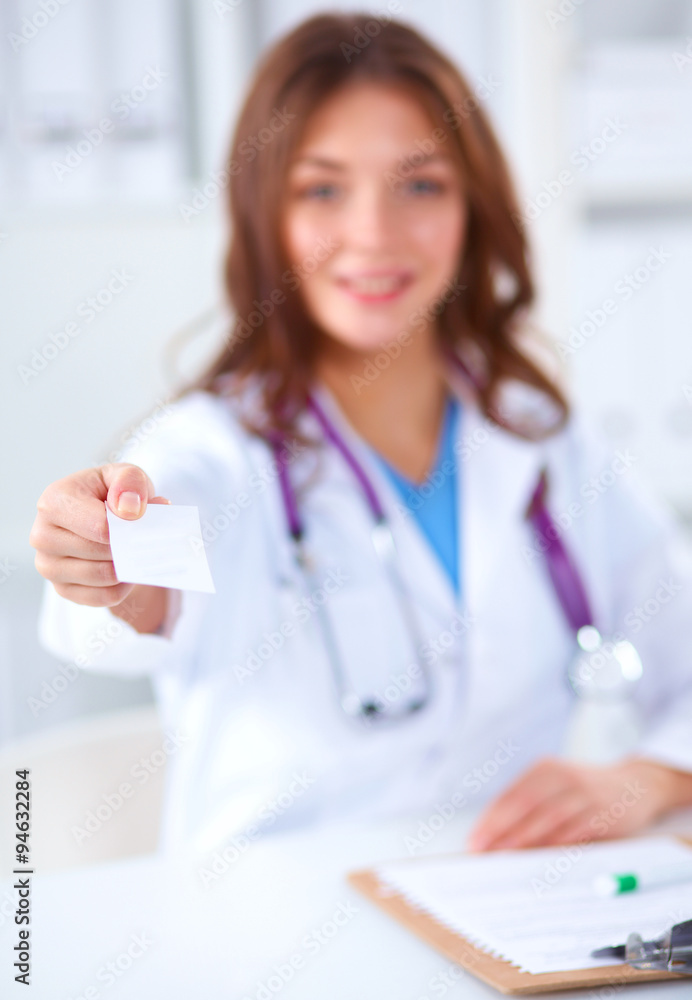 Female doctor holding an empty card, isolated on white background Female doctor holding an empty card, isolated on white background