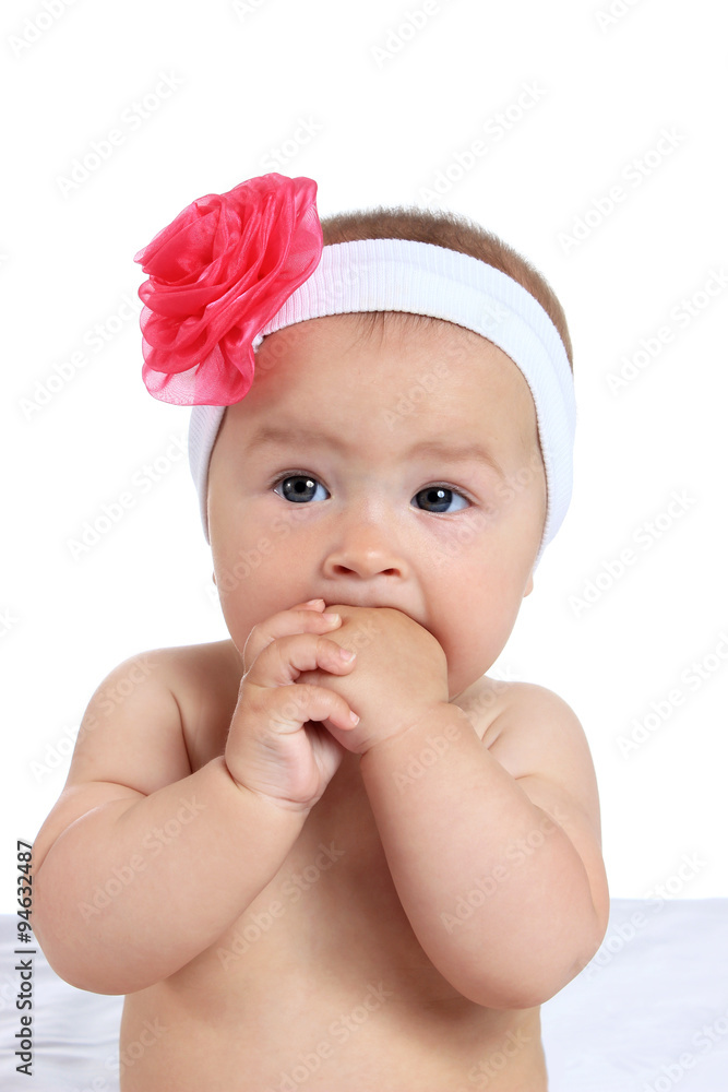 Adorable baby girl on blanket in pampers on a white background Adorable baby girl on blanket in pampers on a white background