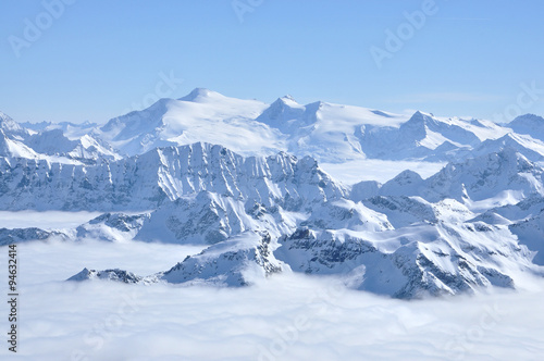 Alpine snow covered peak in the Alps at winter © salajean