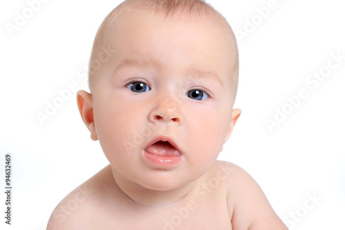 Adorable baby girl on blanket in pampers on a white background