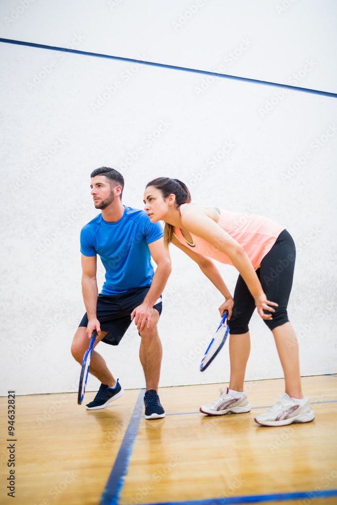 Couple tired after a squash game Couple tired after a squash game