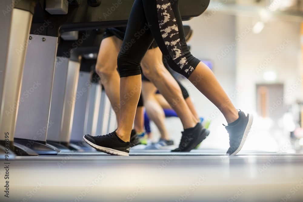 © WavebreakMediaMicro - Fit people jogging on treadmills