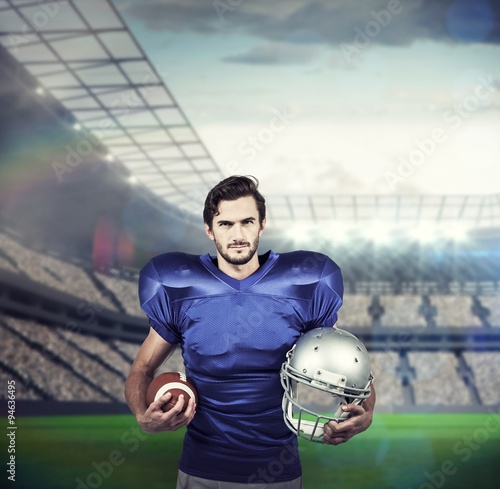 Composite image of american football player holding ball and helmet