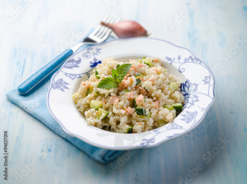 risotto with fresh salmon and zucchinis, selective focus