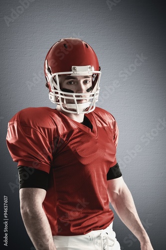 Composite image of american football player looking at the camera