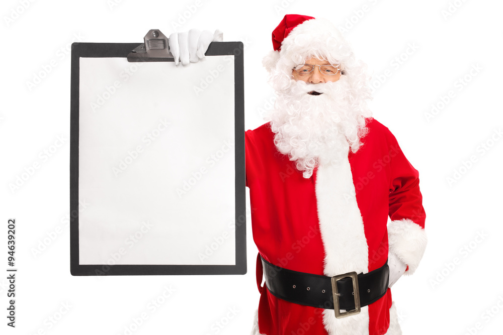 Naklejka premium Santa Claus holding a clipboard with a blank paper