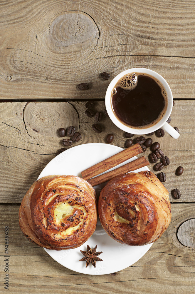 Two buns with jam and cup of coffee Two buns with jam and cup of coffee