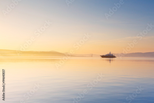 Milos bay as seen from Adamantas village on a misty morning. © milangonda
