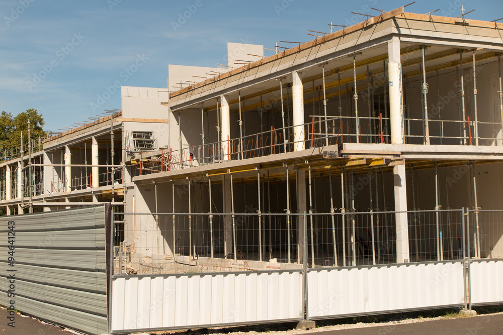 Obraz premium Construction site under construction against blue sky.