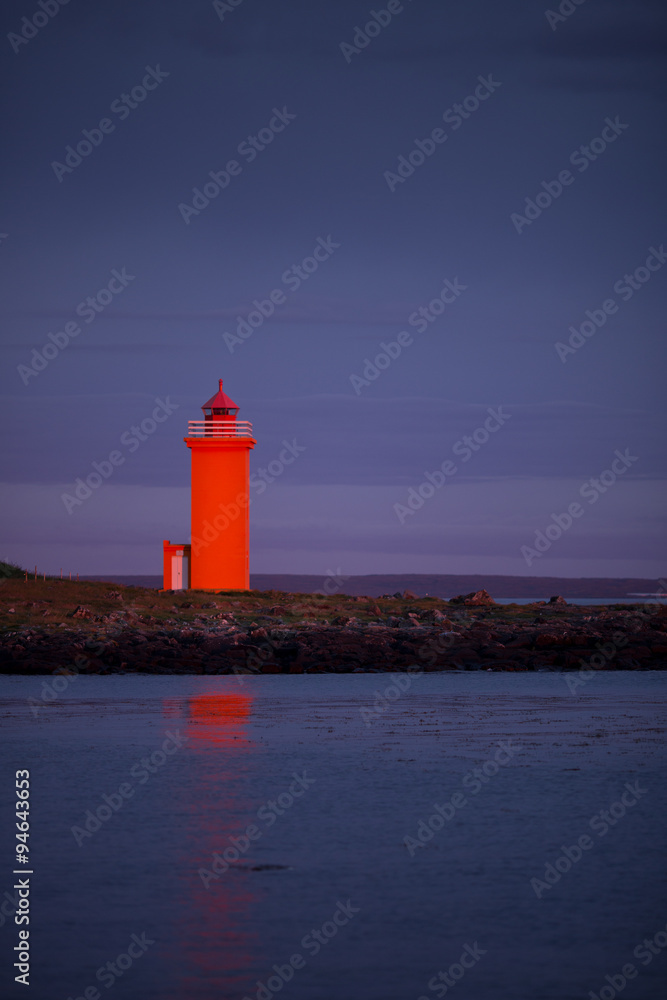 orange lighthouse at the westcoast of Iceland